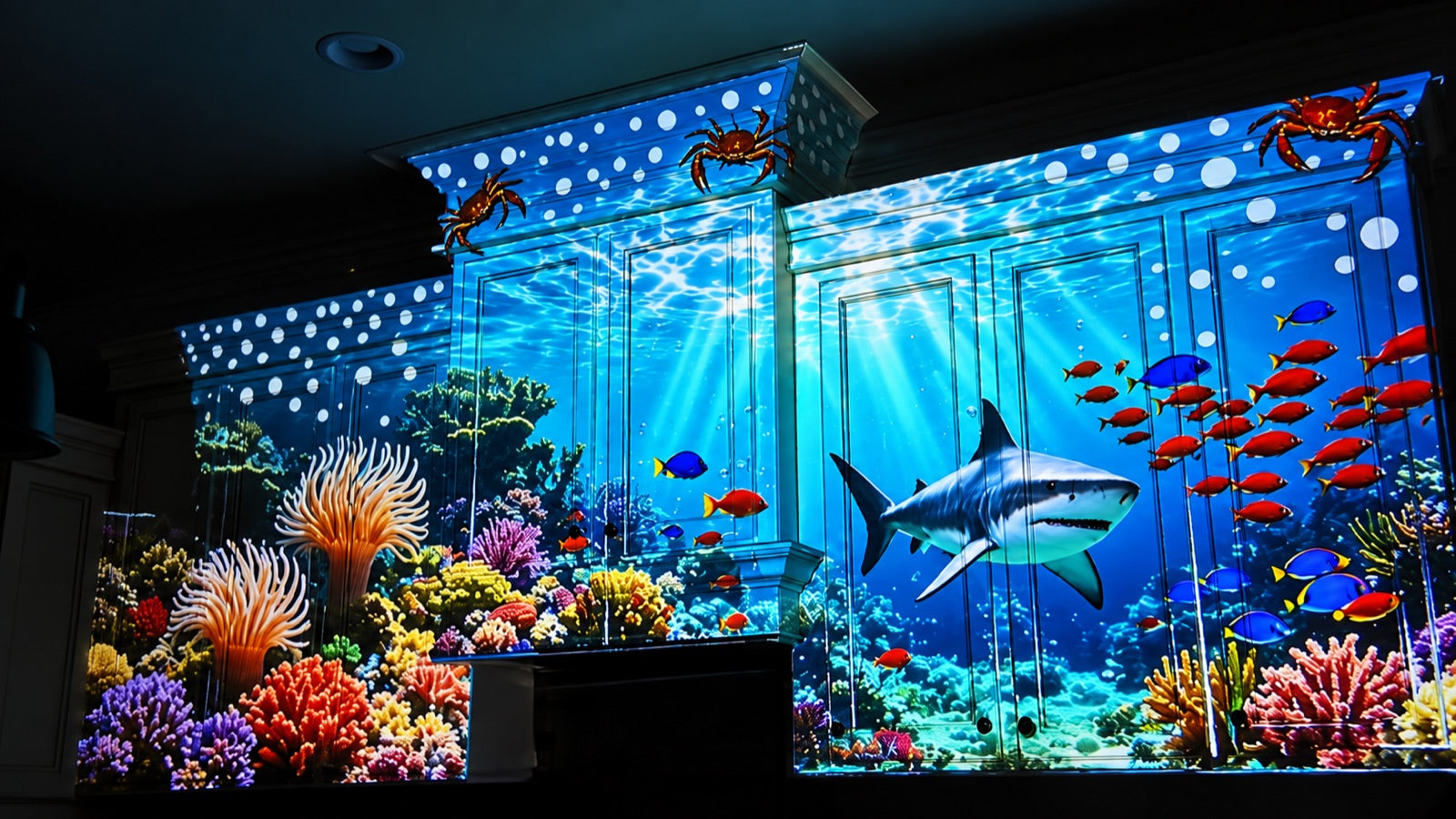 Underwater projection mapping across kitchen cabinets with a shark, coral and tropical fish